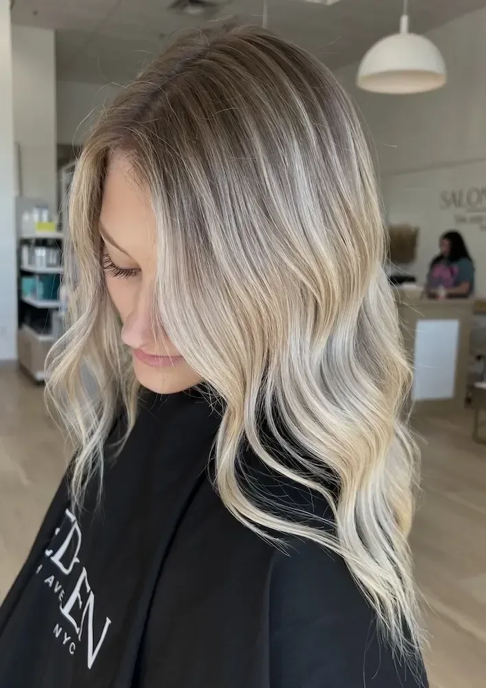 Dimensional balayage blending from brunette roots to blonde ends